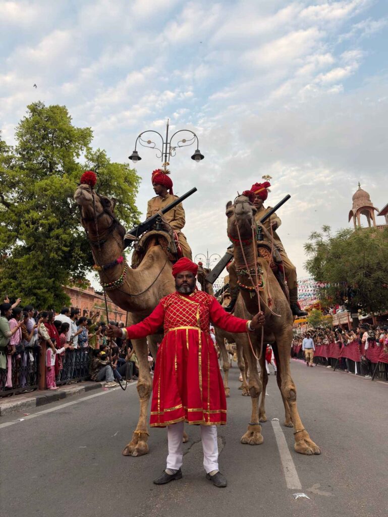 Traditional camel procession with ceremonial riders during the Teej Festival in Jaipur