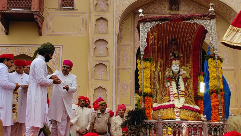 Teej Mata in a decorated palanquin during the Jaipur Teej Festival procession
