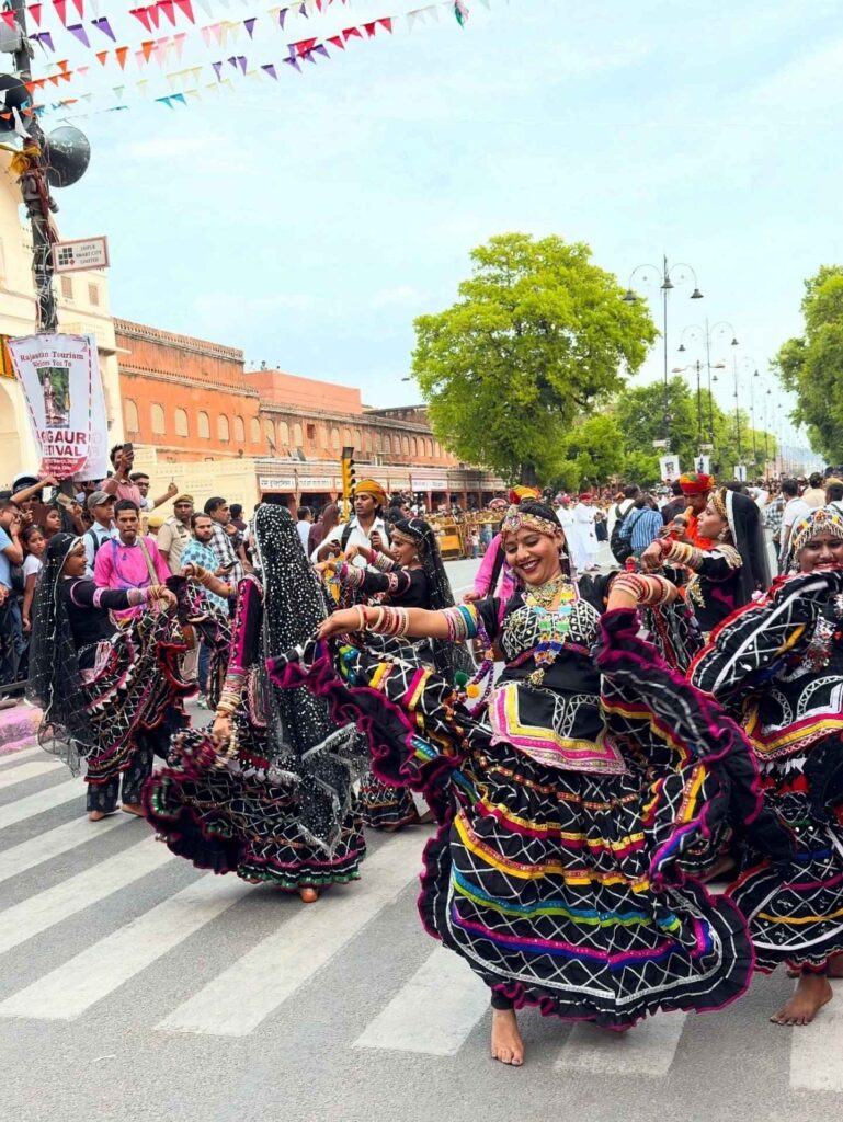 Kalbeliya dancers performing during the traditional Teej Festival procession in Jaipur