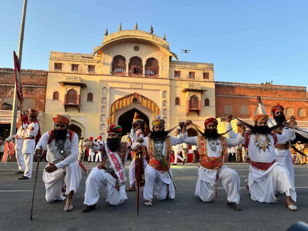 Traditional Rajasthani folk artists performing during the Teej procession in Jaipur