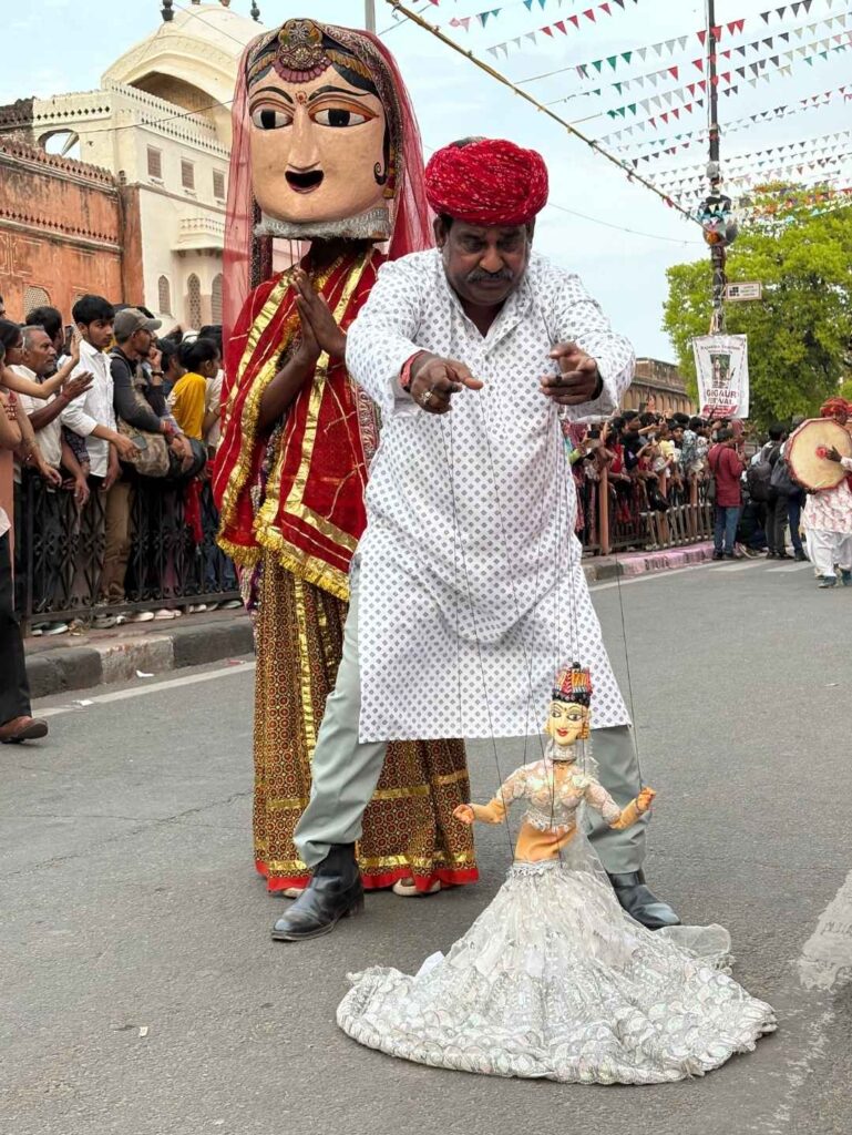 Rajasthani puppeteer performing a traditional puppet show during the Teej Festival in Jaipur