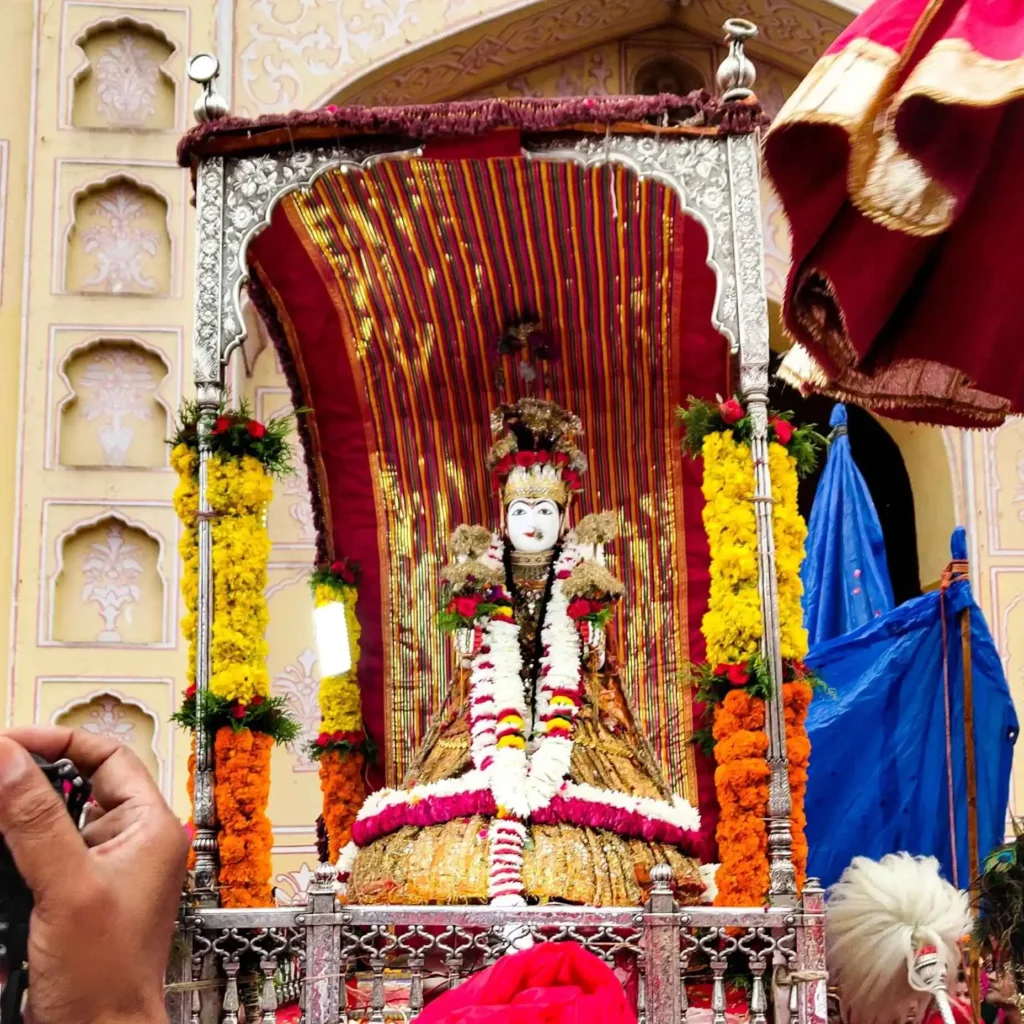 Teej Mata decorated with flowers during the traditional Teej Festival in Jaipur